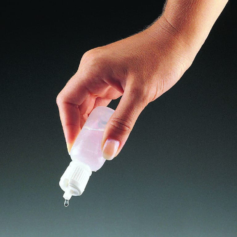 Dispensing Bottles with Hinged Caps