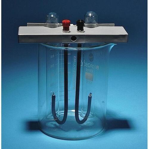 Brownlee Electrolysis Apparatus with Beaker, Platinum electrodes attached to insulated connecting rods which attached to binding posts mounted on a nonconducting support. Support rests across the top of a beaker and has 2 clips that hold an inverted test tube, 6V battery or 10V DC power supply