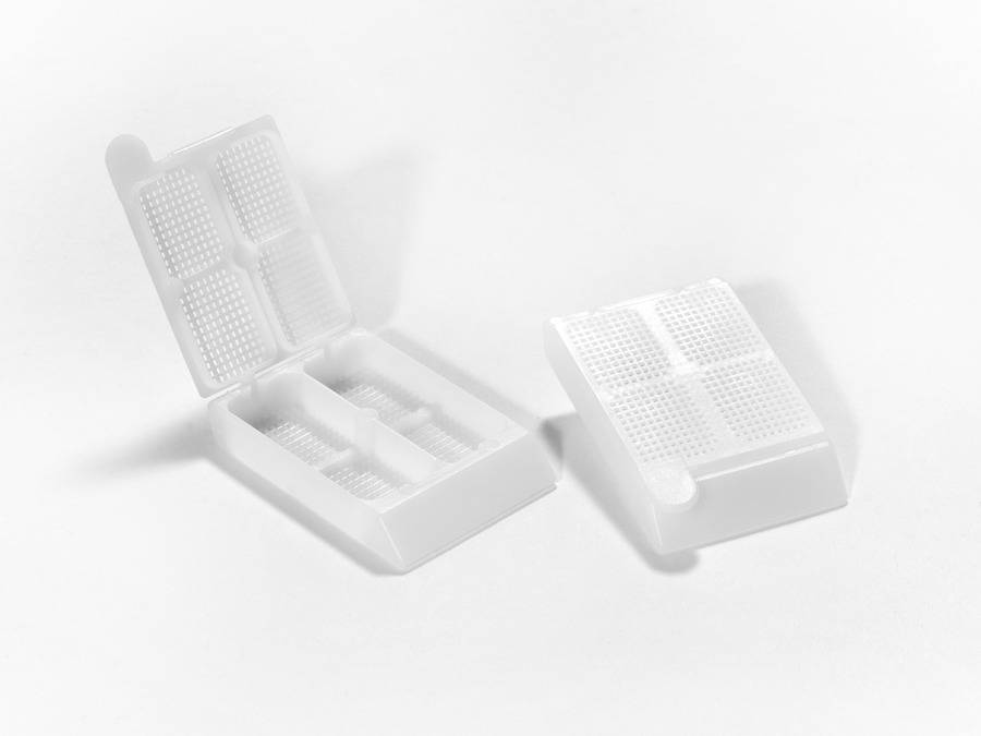 Compartmented Cassette, White, Acetal, resistant to histological solvents such as alcohol and xylene, Acetal will also keep the specimen submerged, Modified ball-and-socket hinge design for ease of opening and closing and also for detachment, 0.6 mm holes, Size: 2 compartments